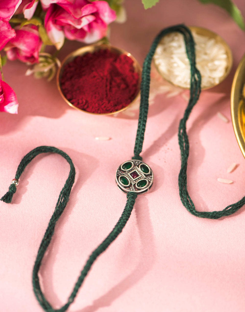 Dark-Green Metal Geometrical Motif With Multi Stones Rakhi