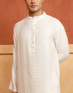 White Dobby Long Kurta styled for festive occasions