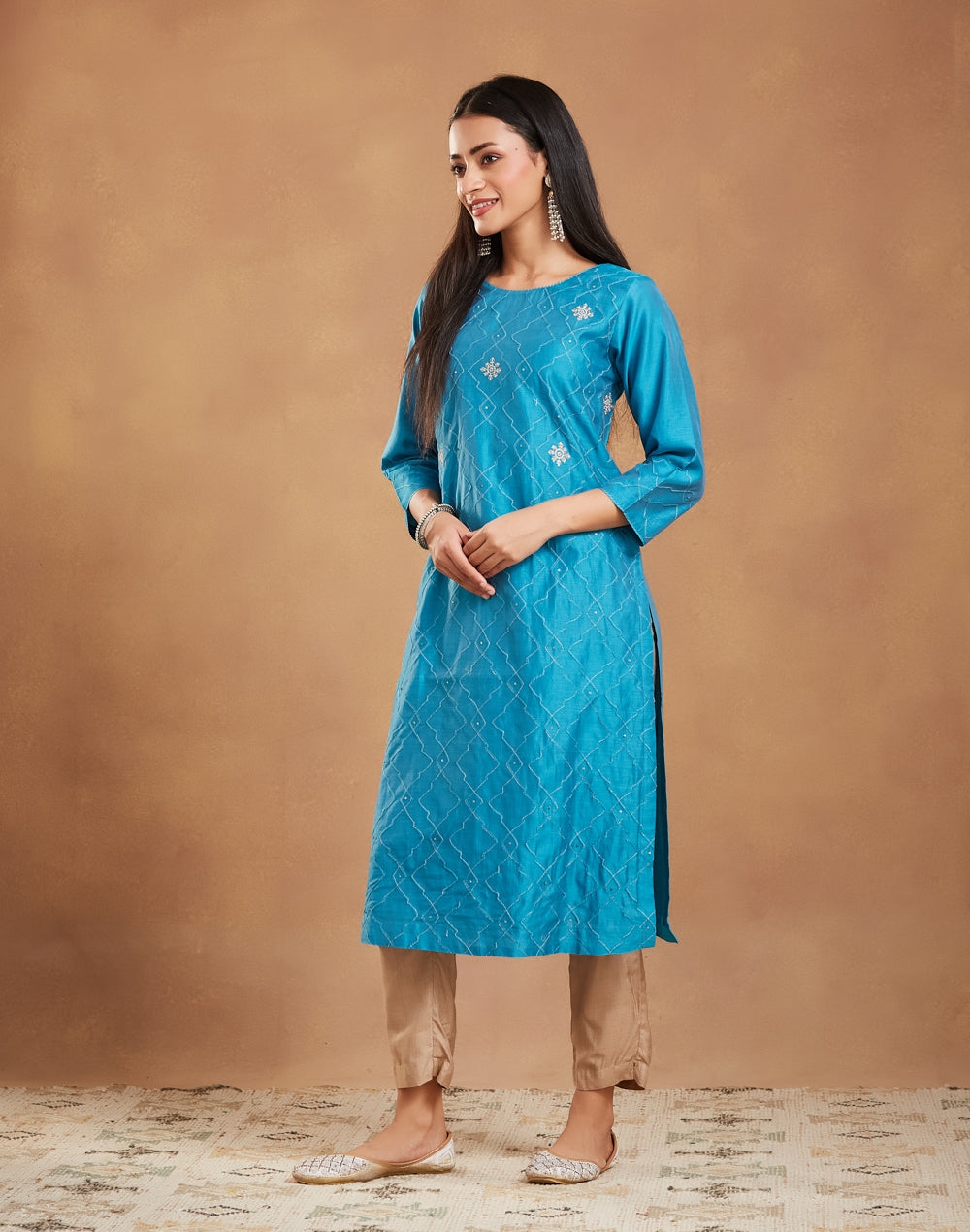 Teal Embroidered Long Kurta with round neck and three-quarter sleeves