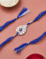 Blue Metal Tear Drop Motif Rakhi With Blue Stone