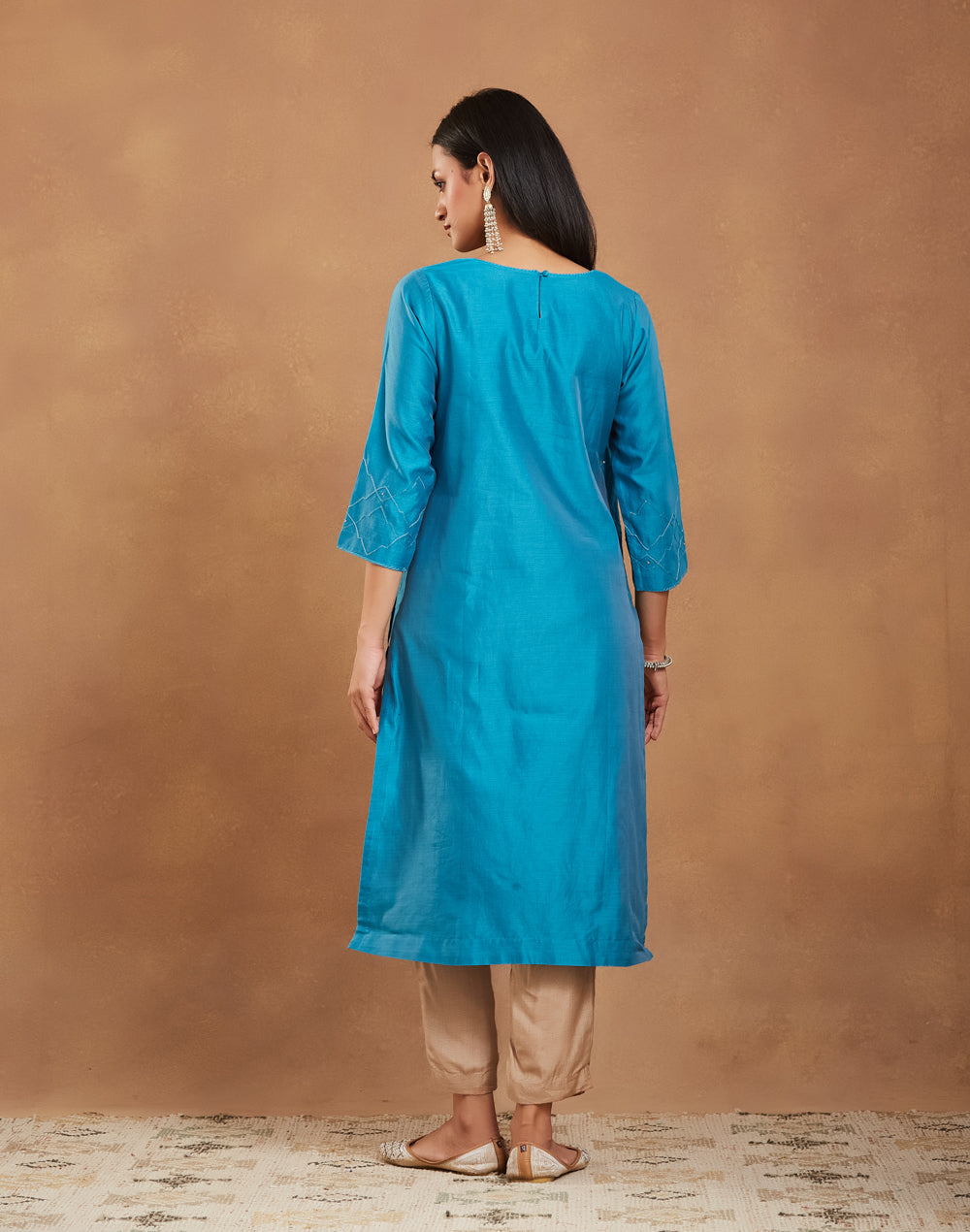 Texture and finish of the Teal Embroidered Long Kurta by Fabindia UK